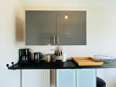 Cuisine ou kitchenette dans l'établissement Appartement vue mer, terrasse parking et plage