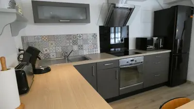 Cuisine ou kitchenette dans l'établissement Maison Centre ville 