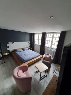 Un ou plusieurs lits dans un hébergement de l'établissement Dream Loft jacuzzi - sauna