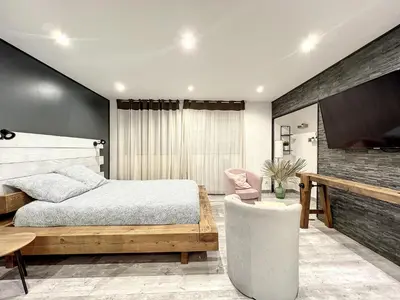 Un ou plusieurs lits dans un hébergement de l'établissement Dream Loft jacuzzi - sauna