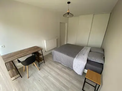 Un ou plusieurs lits dans un hébergement de l'établissement Magnifique appartement à deux pas du centre ville!