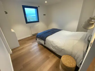 Un ou plusieurs lits dans un hébergement de l'établissement Ty Dag - Grande Terre, front de mer et spa