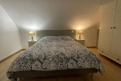 Un ou plusieurs lits dans un hébergement de l'établissement Maison à l'orée du bois du Kador
