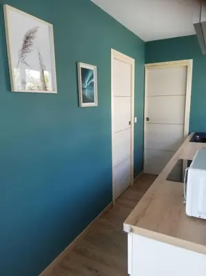 Un ou plusieurs lits dans un hébergement de l'établissement Jolie petite maison indépendante de plain-pied