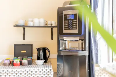 Cuisine ou kitchenette dans l'établissement Hôtel de la Mairie