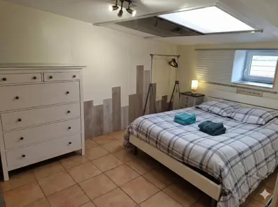 Un ou plusieurs lits dans un hébergement de l'établissement Gîte Kerlosvézan - 2 personnes - 5mn Mer - GR34 - V45