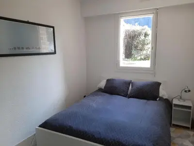 Un ou plusieurs lits dans un hébergement de l'établissement Ty Cocoon- Appartement avec terrasse et parking privé