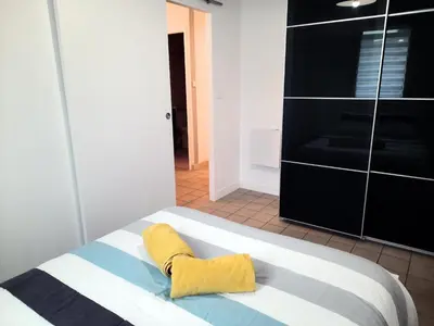 Un ou plusieurs lits dans un hébergement de l'établissement Ty Cocoon- Appartement avec terrasse et parking privé