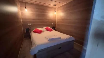 Un ou plusieurs lits dans un hébergement de l'établissement Le Gîte les NUZ ( parc du château de Keroüartz)