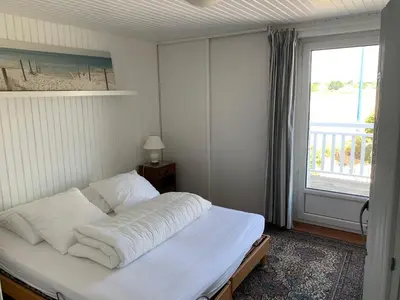 Un ou plusieurs lits dans un hébergement de l'établissement Maison sur la pointe du Cap Coz