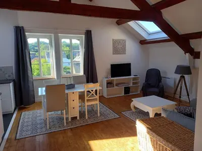 Télévision ou salle de divertissement dans l'établissement Au coeur de Sainte-Christine