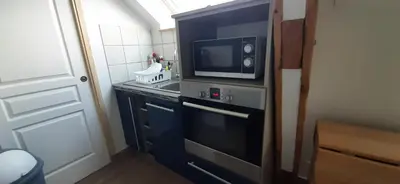 Cuisine ou kitchenette dans l'établissement 16 BIS C Les Gîtes Bigoudens