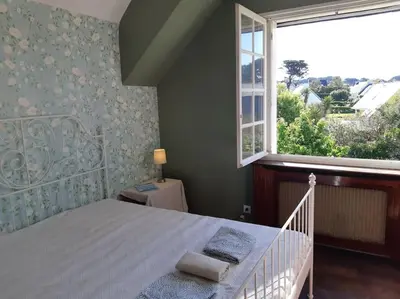 Un ou plusieurs lits dans un hébergement de l'établissement Maison bord de mer