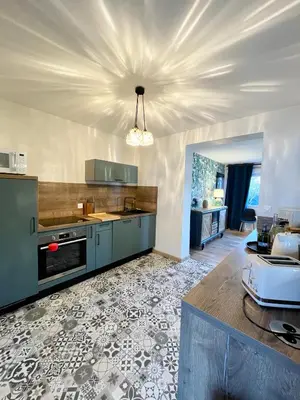 Cuisine ou kitchenette dans l'établissement Maison cosy proche du port et des commerces