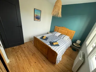 Un ou plusieurs lits dans un hébergement de l'établissement Maison cosy proche du port et des commerces