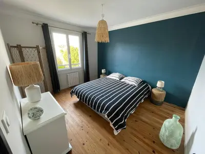 Un ou plusieurs lits dans un hébergement de l'établissement Maison cosy proche du port et des commerces