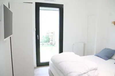 Un ou plusieurs lits dans un hébergement de l'établissement Ty Dag - Petite Terre vue mer, spa, plage à 300m