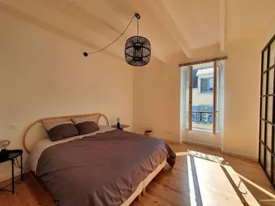 Un ou plusieurs lits dans un hébergement de l'établissement Maison de ville - Plage à pied