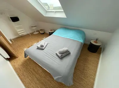 Un ou plusieurs lits dans un hébergement de l'établissement Maison de ville - Plage à pied