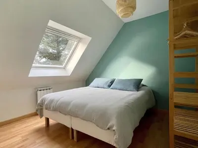 Un ou plusieurs lits dans un hébergement de l'établissement Holiday Home in Terenez with Sea Views