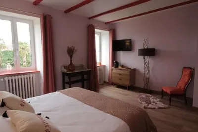 Un ou plusieurs lits dans un hébergement de l'établissement Le Manoir de Kérofil ** Gîte et chambres d'hôtes **