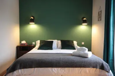 Un ou plusieurs lits dans un hébergement de l'établissement Le Manoir de Kérofil ** Gîte et chambres d'hôtes **