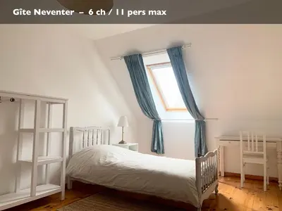 Un ou plusieurs lits dans un hébergement de l'établissement Les Gîtes du Manoir de Keryvon