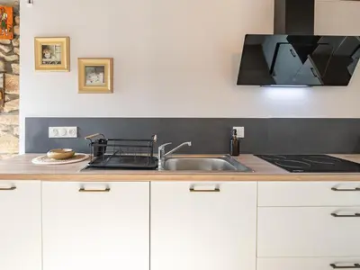 Cuisine ou kitchenette dans l'établissement Holiday Home Ty Lez by Interhome