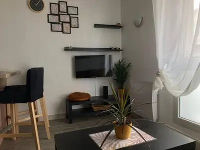 Télévision ou salle de divertissement dans l'établissement Cozy'Nest