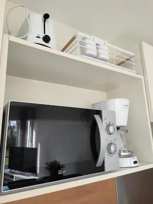 Cuisine ou kitchenette dans l'établissement CHARMANT APPARTEMENT 3 étoiles classé BORD DE MER Travel Award 2026