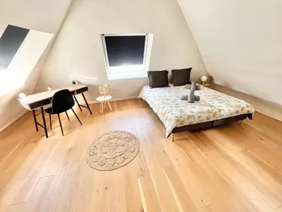 Coin salon dans l'établissement LE NID DES QUAIS - Vue Panoramique au cœur de la ville - Wifi - Entrée autonome