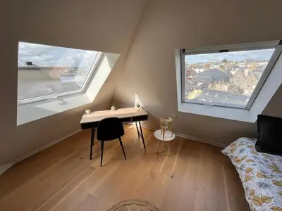 Un ou plusieurs lits dans un hébergement de l'établissement LE NID DES QUAIS - Vue Panoramique au cœur de la ville - Wifi - Entrée autonome