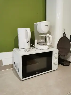 Télévision ou salle de divertissement dans l'établissement Les gîtes de L'hermine