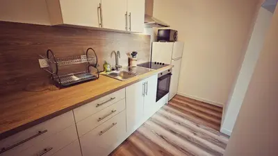 Cuisine ou kitchenette dans l'établissement Logements neufs à Bannalec Centre