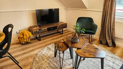 Télévision ou salle de divertissement dans l'établissement Logements neufs à Bannalec Centre