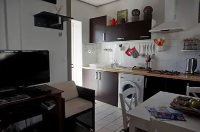 Cuisine ou kitchenette dans l'établissement Maison de vacances La Palue entre plage et centre bourg