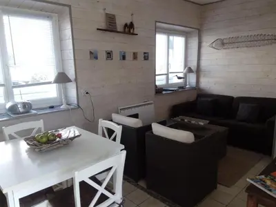 Coin salon dans l'établissement Maison de vacances La Palue entre plage et centre bourg