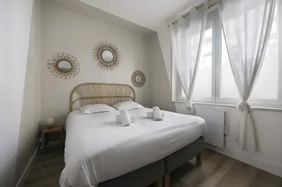 Un ou plusieurs lits dans un hébergement de l'établissement Appartement cozy au centre-ville
