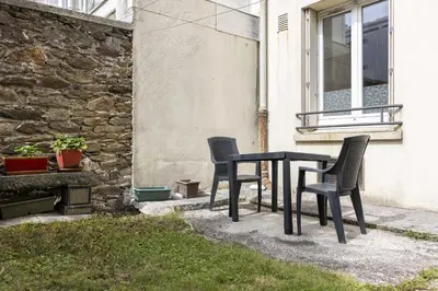 Jardin de l'établissement Appartement cozy au centre-ville