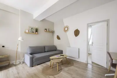 Coin salon dans l'établissement Appartement cozy au centre-ville