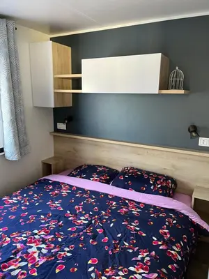 Un ou plusieurs lits dans un hébergement de l'établissement Mobilhome bora bora