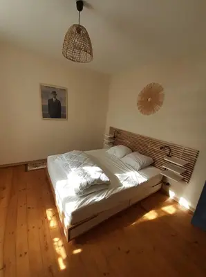 Un ou plusieurs lits dans un hébergement de l'établissement Ker Yaël – Maison familiale avec grand jardin à 5min de la plage Saint Jean du doigt