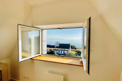 Télévision ou salle de divertissement dans l'établissement Le paradis bleu