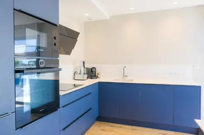 Cuisine ou kitchenette dans l'établissement Escale à Saint-Gué