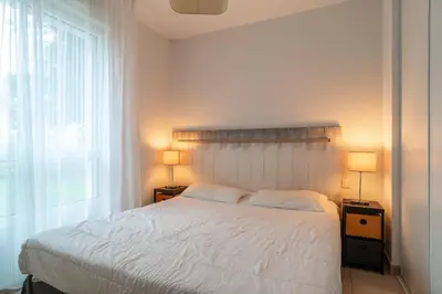 Un ou plusieurs lits dans un hébergement de l'établissement L'Arvor - Appt piscine et sauna partagés