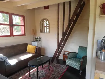 Coin salon dans l'établissement Chalet cosy en lisière de forêt
