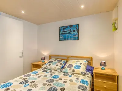 Un ou plusieurs lits dans un hébergement de l'établissement Holiday Home La Glycine by Interhome