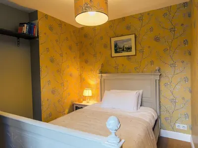 Un ou plusieurs lits dans un hébergement de l'établissement Apartment Penguilly by Interhome