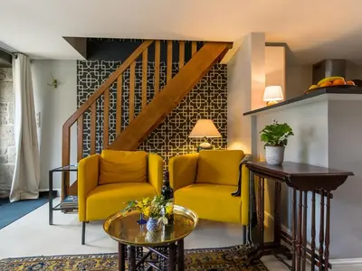 Coin salon dans l'établissement Apartment Penguilly by Interhome