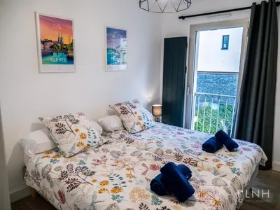 Un ou plusieurs lits dans un hébergement de l'établissement L'appartement de jeanne